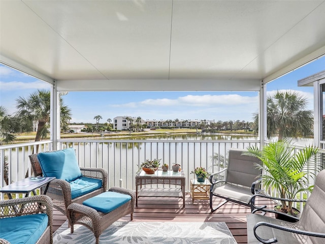 21687/689 Indian Bayou Dr, Fort Myers Beach, FL 33931 - sunroom / solarium with a water view and wood finished floors