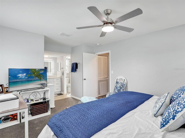 21687/689 Indian Bayou Dr, Fort Myers Beach, FL 33931 - carpeted bedroom with connected bathroom, visible vents, and a ceiling fan