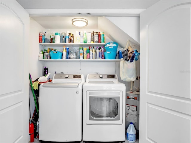 21687/689 Indian Bayou Dr, Fort Myers Beach, FL 33931 - clothes washing area with water heater, washer and dryer, and laundry area