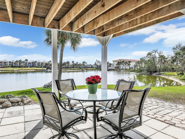 21687/689 Indian Bayou Dr, Fort Myers Beach, FL 33931 - view of patio / terrace featuring a water view and outdoor dining area
