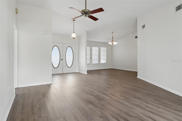 23116 Amethyst Ave, Port Charlotte, FL 33952 - unfurnished living room featuring baseboards, ceiling fan with notable chandelier, wood finished floors, and visible vents