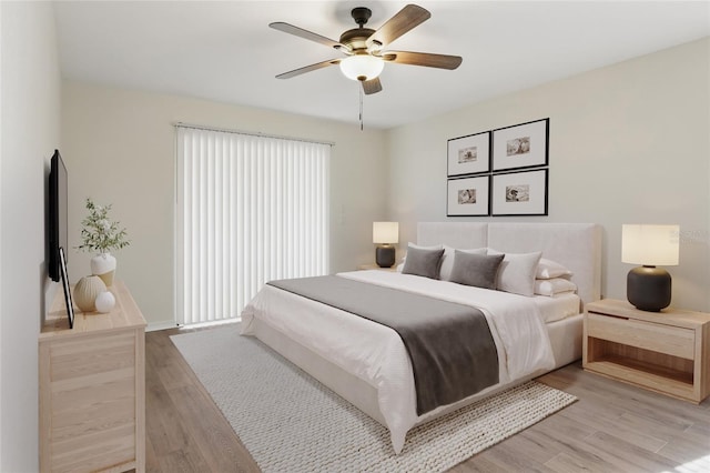 23116 Amethyst Ave, Port Charlotte, FL 33952 - bedroom with light wood-type flooring, a ceiling fan, and baseboards