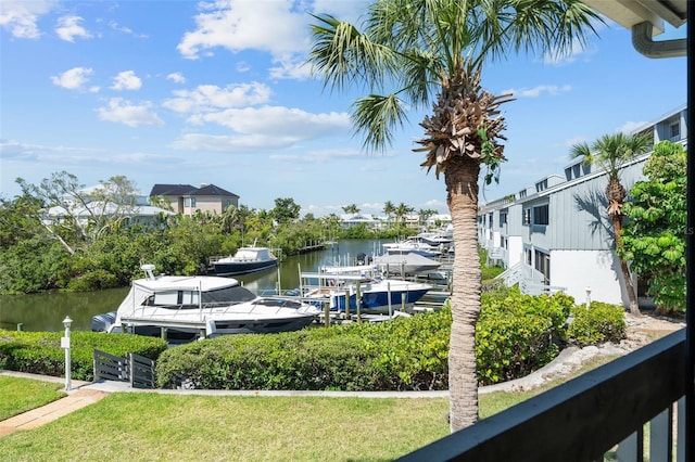1233 Dockside Pl Unit 207, Sarasota, FL 34242 - dock area featuring a water view and a lawn