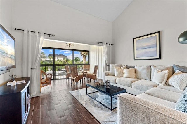 1233 Dockside Pl Unit 207, Sarasota, FL 34242 - living area featuring high vaulted ceiling, a chandelier, and dark wood finished floors
