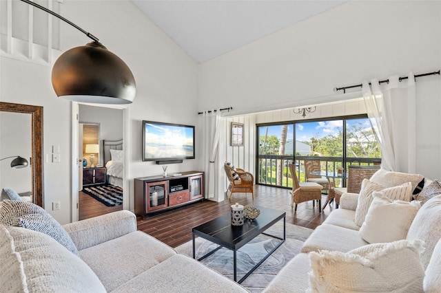 1233 Dockside Pl Unit 207, Sarasota, FL 34242 - living room with high vaulted ceiling and wood finished floors