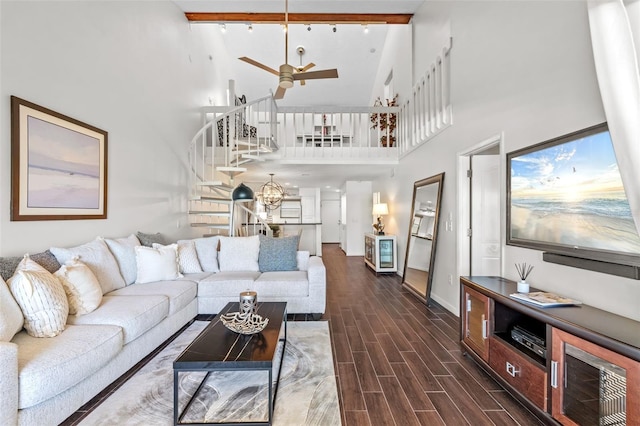 1233 Dockside Pl Unit 207, Sarasota, FL 34242 - living room with high vaulted ceiling, stairway, dark wood-style floors, a ceiling fan, and baseboards