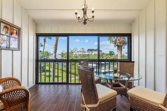 1233 Dockside Pl Unit 207, Sarasota, FL 34242 - sunroom / solarium featuring a chandelier and plenty of natural light