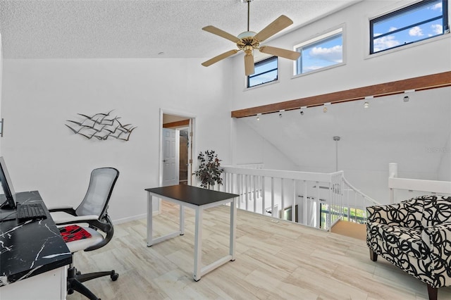 1233 Dockside Pl Unit 207, Sarasota, FL 34242 - office with a ceiling fan, high vaulted ceiling, and a textured ceiling