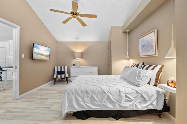 1233 Dockside Pl Unit 207, Sarasota, FL 34242 - bedroom with lofted ceiling, a textured ceiling, baseboards, and a ceiling fan