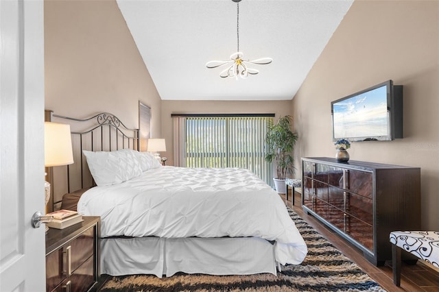 1233 Dockside Pl Unit 207, Sarasota, FL 34242 - bedroom with a chandelier, lofted ceiling, and wood finished floors