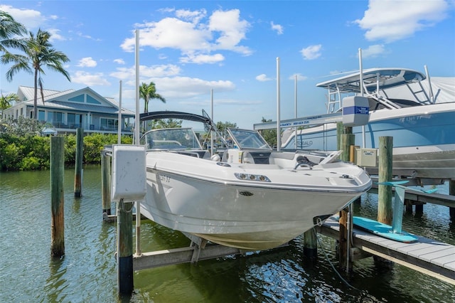 1233 Dockside Pl Unit 207, Sarasota, FL 34242 - dock area with boat lift and a water view