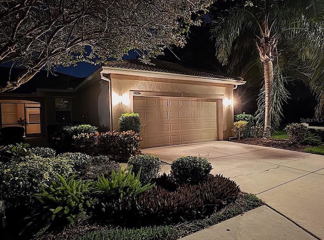 4136 Cascade Falls Dr, Sarasota, FL 34243 - garage featuring concrete driveway
