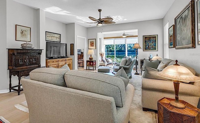 4136 Cascade Falls Dr, Sarasota, FL 34243 - living area featuring a ceiling fan, light wood finished floors, and baseboards