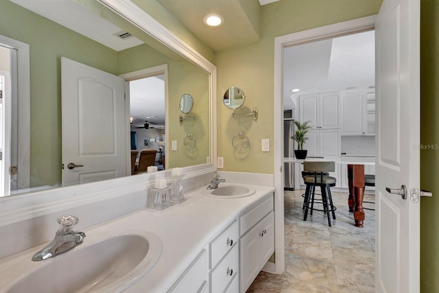 5209 26th Ave W, Bradenton, FL 34209 - bathroom featuring double vanity and a ceiling fan