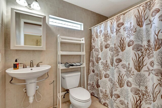 5209 26th Ave W, Bradenton, FL 34209 - bathroom with tile walls, toilet, and a shower with curtain
