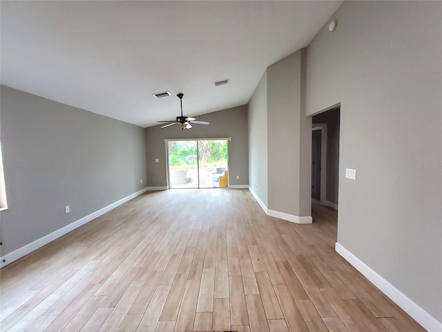 empty room with baseboards, visible vents, a ceiling fan, and light wood finished floors