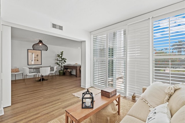 living room with wood finished floors and baseboards