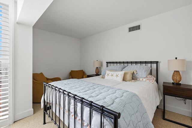 carpeted bedroom featuring baseboards
