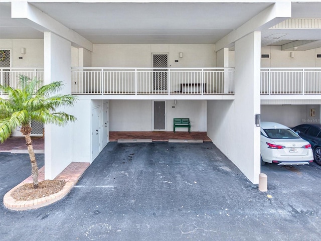 view of property with covered parking
