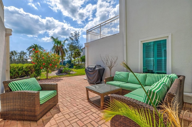 view of patio featuring an outdoor hangout area and a grill