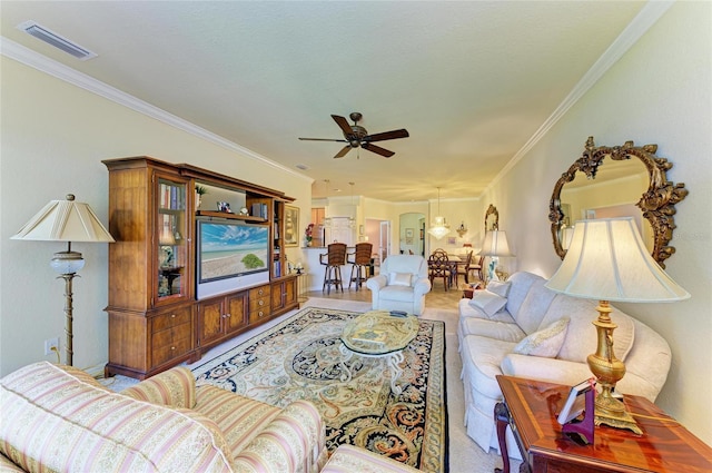 19889 Benissimo Dr, Venice, FL 34293 - living area featuring ceiling fan with notable chandelier, visible vents, crown molding, and carpet floors