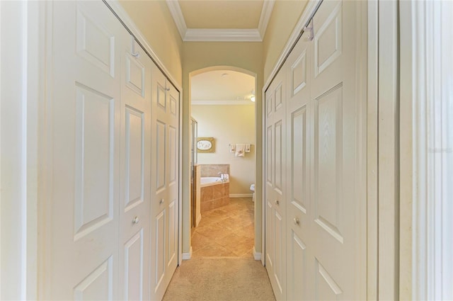 19889 Benissimo Dr, Venice, FL 34293 - hall featuring arched walkways, ornamental molding, and light tile patterned floors