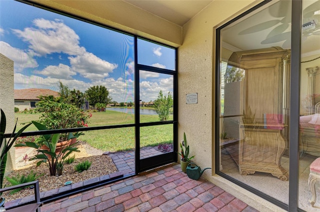 19889 Benissimo Dr, Venice, FL 34293 - unfurnished sunroom with a water view
