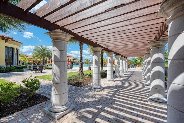 19889 Benissimo Dr, Venice, FL 34293 - view of patio with a pergola and outdoor dining space