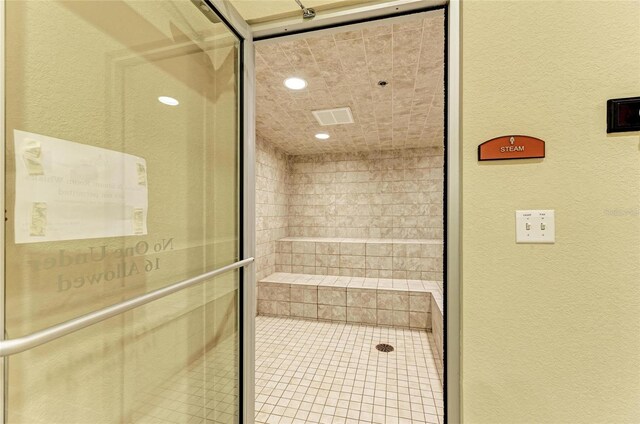 19889 Benissimo Dr, Venice, FL 34293 - full bath with a textured wall, a stall shower, and recessed lighting