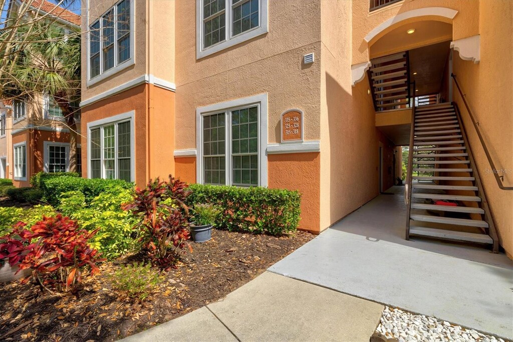 4178 Central Sarasota Pkwy Unit 325, Sarasota, FL 34238 - doorway to property featuring stucco siding