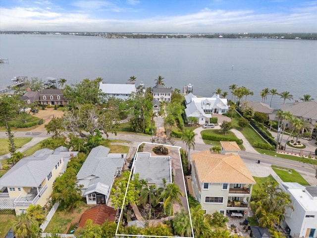 birds eye view of property with a residential view and a water view