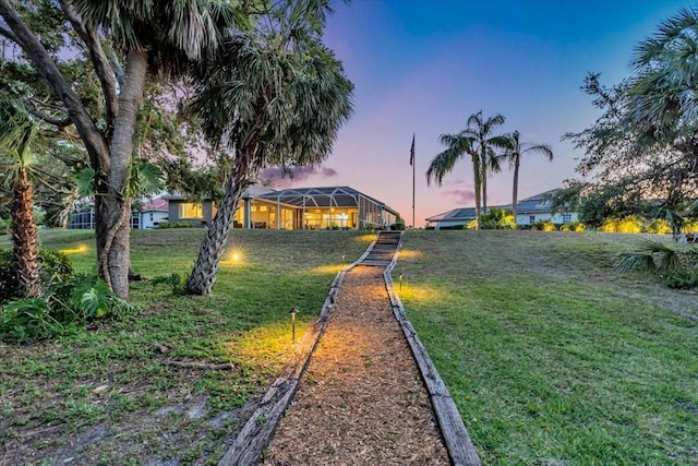 yard at dusk with glass enclosure