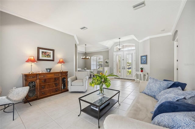 living room with light tile patterned floors, ornamental molding, french doors, and visible vents