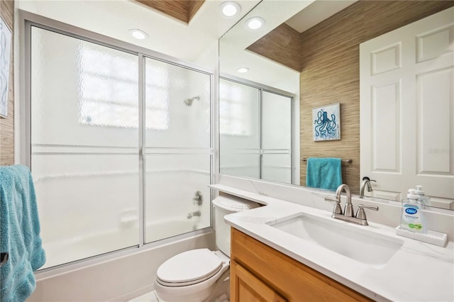 full bath featuring vanity, recessed lighting, enclosed tub / shower combo, and toilet