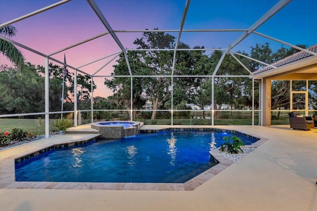 view of pool with a lanai, a patio, and a pool with connected hot tub