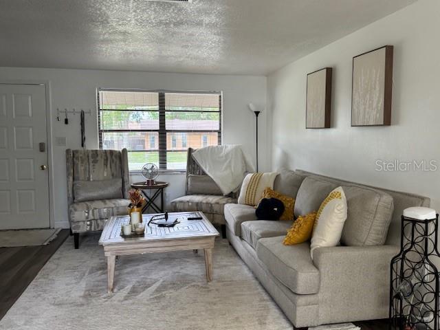831 Bacon Ave, Sarasota, FL 34232 - living area featuring a textured ceiling