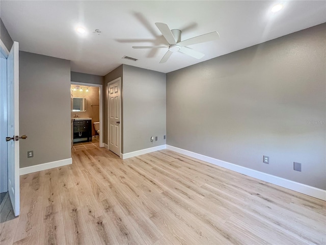 4850 51st St W Unit 4205, Bradenton, FL 34210 - unfurnished bedroom featuring visible vents, a ceiling fan, baseboards, light wood-style flooring, and ensuite bathroom