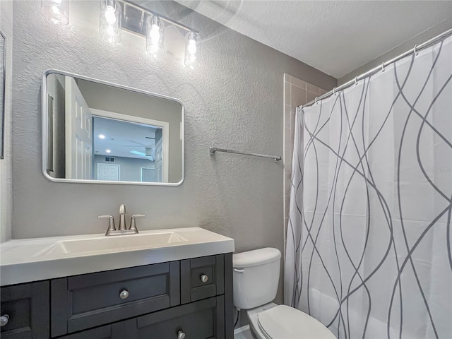 4850 51st St W Unit 4205, Bradenton, FL 34210 - full bathroom featuring a textured wall, vanity, a shower with shower curtain, and toilet