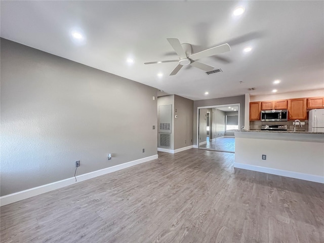 4850 51st St W Unit 4205, Bradenton, FL 34210 - unfurnished living room featuring recessed lighting, visible vents, a ceiling fan, light wood-type flooring, and baseboards