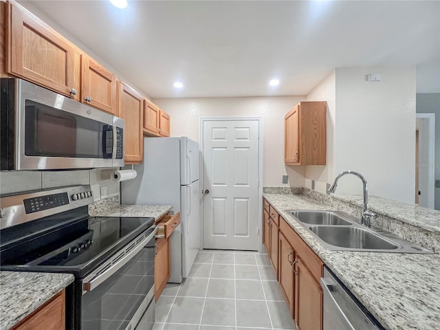 4850 51st St W Unit 4205, Bradenton, FL 34210 - kitchen with light tile patterned flooring, appliances with stainless steel finishes, recessed lighting, and a sink