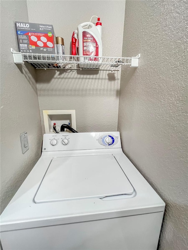 4850 51st St W Unit 4205, Bradenton, FL 34210 - laundry room with a textured wall, laundry area, and washer / clothes dryer
