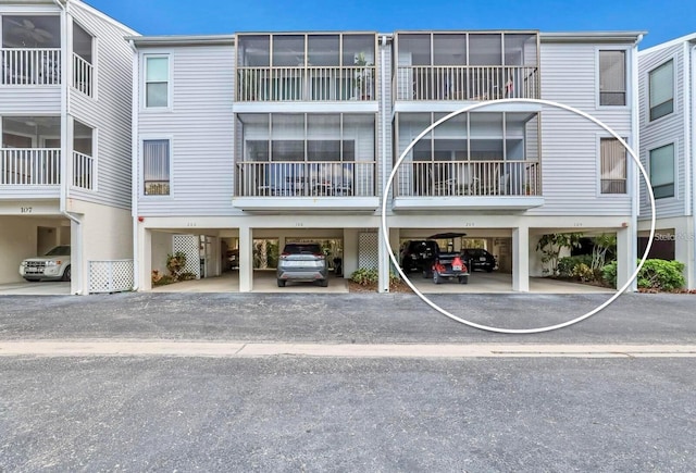 view of property featuring covered parking