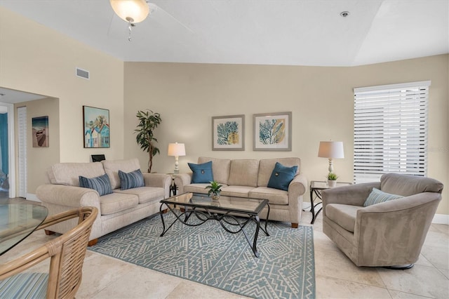 living room featuring visible vents, a ceiling fan, baseboards, and light tile patterned floors