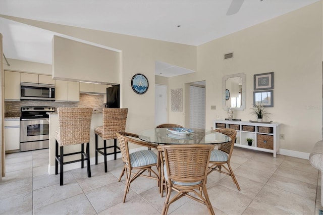 dining room featuring visible vents and light tile patterned flooring