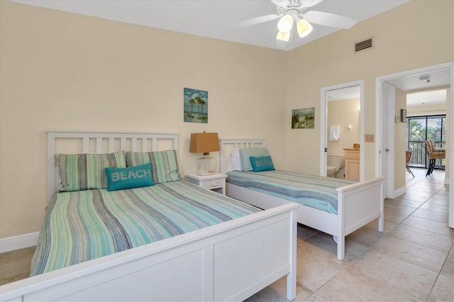 bedroom featuring baseboards and visible vents