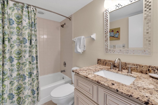 bathroom featuring vanity, toilet, and shower / tub combo