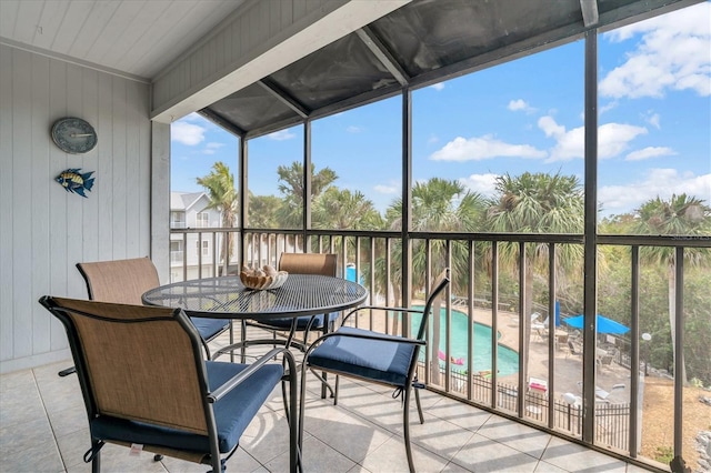 sunroom with outdoor dining space