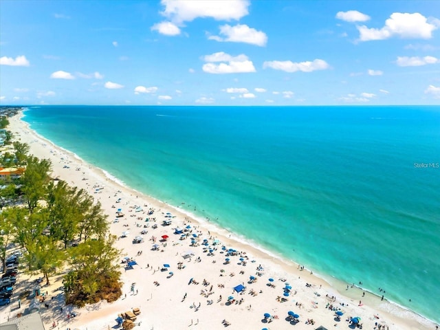 bird's eye view with a water view and a view of the beach