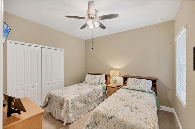 2628 Sapphire Blue Ln, Bradenton, FL 34211 - bedroom featuring light carpet, a closet, ceiling fan, and baseboards