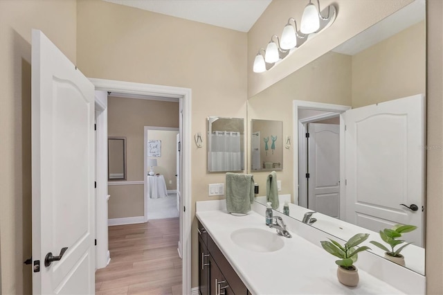 2628 Sapphire Blue Ln, Bradenton, FL 34211 - bathroom featuring wood finished floors, vanity, and baseboards